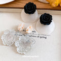 Oversized Resin Flower Drop Earrings In Black And Clear view 2