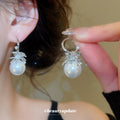 Silver Crystal and Pearl Huggie Earrings with Floral Accents view 1