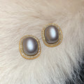 Gold Framed Oval Pearl Stud Earrings Decorative Jewelry Design view 6
