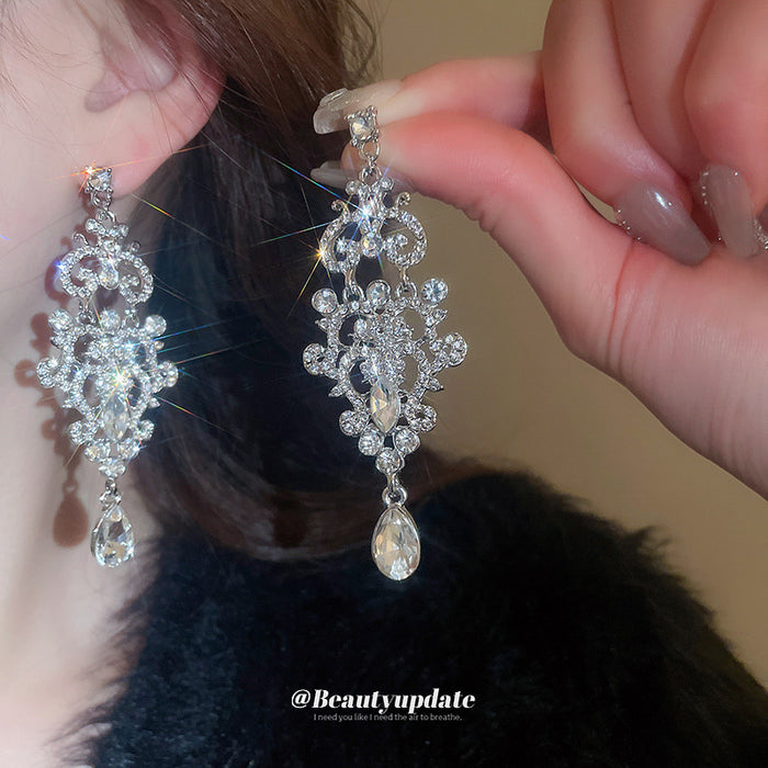 Silver Tone Ornate Openwork Crystal Teardrop Earrings