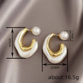 Gold Tone Curved Stud Earrings With Pearl Accent Backs view 4