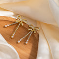 Gold Bow Triple Chain Pearl Look Long Stud Earrings view 6