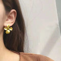 Gold Matte Four-Petal Flower Stud Earrings Dark Crystal Center view 3