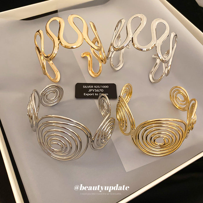 Spiral Disk And Organic Loop Open Cuffs In Gold Or Silver Tone