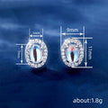 Silver Tone Oval Moonstone Look Halo Stud Earrings view 4