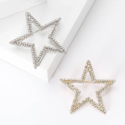 An open five-point star edged with clear crystals shown on a white background