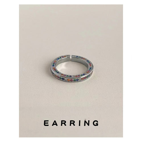 Silver multicolor double-row pavé open ring on beige with EARRING text