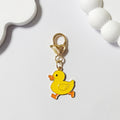 Gold Tone Yellow Duck Heart-Clasp Charms in Twelve Playful Designs view 6