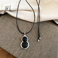 Black Cord Double Gourd Pendant Necklace in Black and Brown view 6