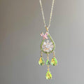 Floral Crystal Teardrop Earrings and Necklace with Polished Metal Details view 9