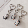 Flocked Penguin Heart-Clasp Charms in Three Distinct Poses view 1