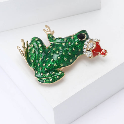 Angled view of the enamel frog prince brooch
