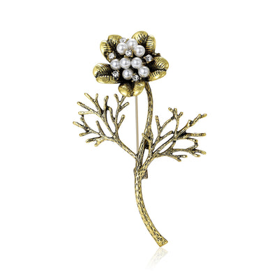 Antique gold pearl center plant branch brooch front view