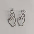 Outline Finger Heart Gesture Stud Earrings Four Metal Finishes view 5