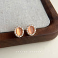 Gold Tone Peach Oval Stone White Pearl Like Halo Stud Earrings view 6