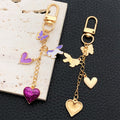 Purple Heart Butterfly and Carousel Metal Clasp Keychain Set view 2