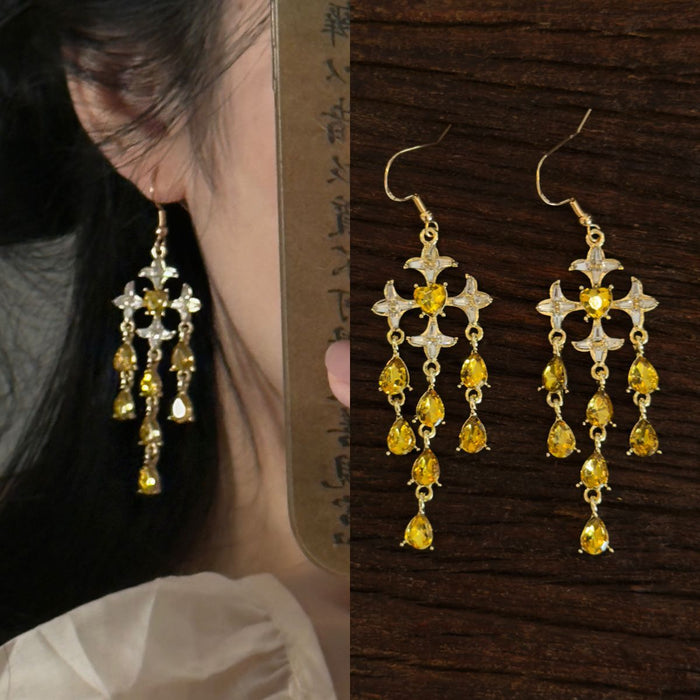 Gold Tone Starburst Chandelier Earrings In Three Colors