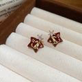 Gold Tone Star Stud Earrings with Red Brown Inlay Designs view 7