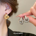 Interlocking Knot Stud Earrings in Gold Tone and Silver Tone view 2