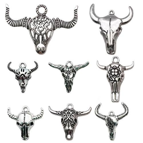 Metallic assorted shape charms arranged on a light background