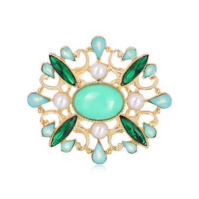 Front product view of the flower brooch pin in gold and green