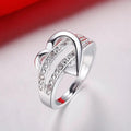 Abstract Heart And Ribbon Clear Stone Ring In Silver Tone view 2