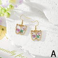 Gold Tone Pressed Flower Butterfly Drop Earrings in Twelve Designs view 2