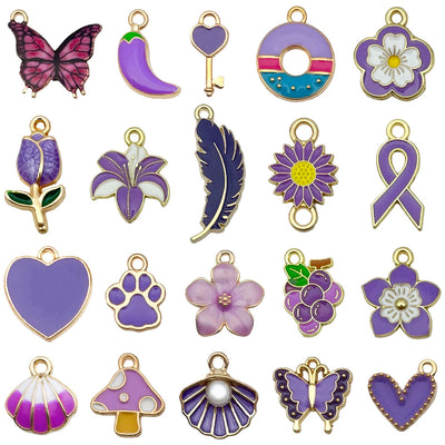 Colorful heart and mushroom charms arranged on a light background