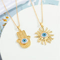 Gold Tone Hamsa Hand and Sun Blue Eye Pendant Necklaces view 1