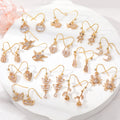 Gold Tone Crystal Animal and Symbol Hook Earrings in Thirteen Designs view 1