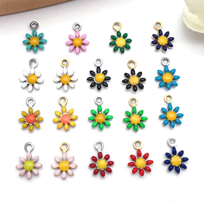 Gold-tone daisy charms arranged on a light background