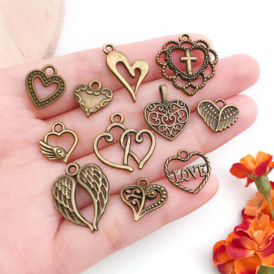 Gold-tone heart charms shown in a close-up product view