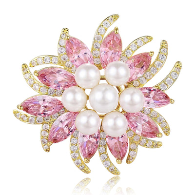 Pearl Center Crystal Flower brooch In Pink And Yellow shown in front view on a light background