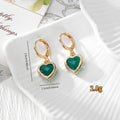 Gold Tone Crystal Heart Huggie Earrings in Seven Color Options view 4