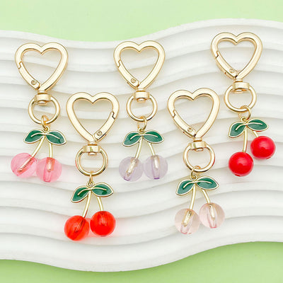 Image 1 showing a set of four heart shaped charms.