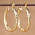 Twisted Oval Hoop Earrings in Three Gold-Tone Styles view 1