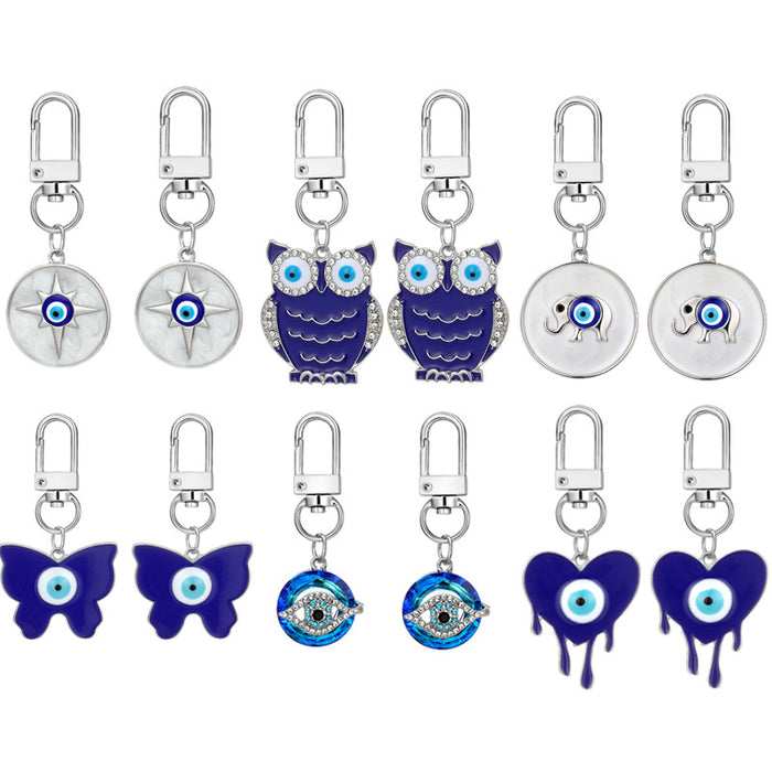 Twelve Piece Silver Tone Butterfly Owl and Evil Eye Keychain Set