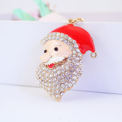 Close front view of the Santa head charm with a red hat and clear rhinestones.