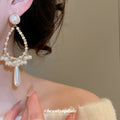 Gold Tone Pearl Look Teardrop Earrings with Long White Drops view 3