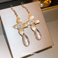 Crystal Leaf and Flower Hook Earrings with Polished Metal Tone Details view 4