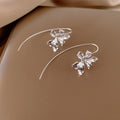 Iris Flower Long Stem Hook Earrings in Gold and Silver view 9