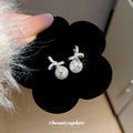 Silver Tone Crystal Bow and Cream Pearl Drop Stud Earrings view 2