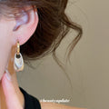 Gold Tone Hoop Earrings With Textured Silver Drop Charms view 4