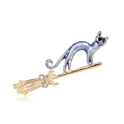 Front product view of the cat brooch pin in gold and silver