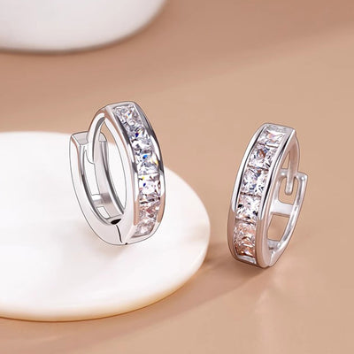 Silver channel-set square clear CZ huggie pair product shot