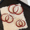 Red Textured Wavy Hoop Earrings in Two Sizes with Detailed Finish view 2
