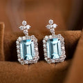 White Gold Light Blue Rectangle Halo Stud Earrings view 1