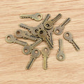 Mini Key Shaped Metal Charms in Four Finish Options view 3