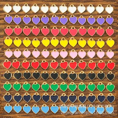 Colorful heart charms arranged on a light background