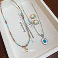 Gold Turquoise Hoops Flower Bead Necklace Silver Oval Pendant view 1